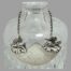 Main photo of ticket displayed hanging around the neck of a decanter and shown in close up forward facing.
