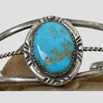Close up photo of the turquoise in the centre of the cuff bracelet.