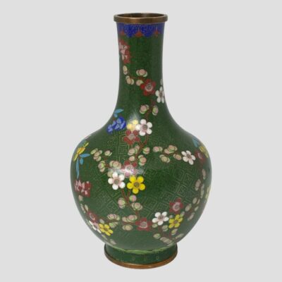 A closer image of the whole vase seen from the side with most blossoms. The spray of white orchids have been removed.