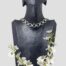 Main photo of collar necklace displayed on a dark wooden display stand which is forward facing. The links of this collar are square and circular alternately with nice solid silver links joining them all together. A really nice piece of solid silver jewellery in a modernistic style.