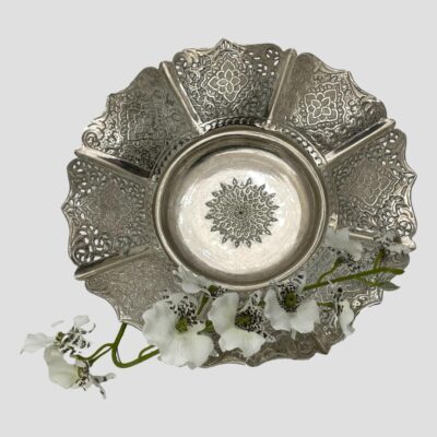 Main photo of bowl shown displayed upright to show the entire inner area. (except along the bottom where a spray of small white orchids lies) The eight sides are raised so when laid flat, you cannot see the bowl inner.