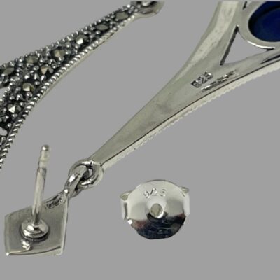 Close up of the 925 hallmark to the back of one earring and the butterfly.