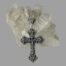 Main photo of cross shown leaning in front of a rock of quartz crystal with the pierced work side on show.