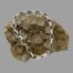 Main photo of bracelet shown displayed over a rock of natural quartz crystal which is a sand colour, The bracelet has the clasp closed which is displayed in the foreground